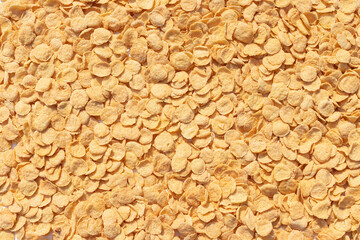 Natural yellow solid background of corn flakes