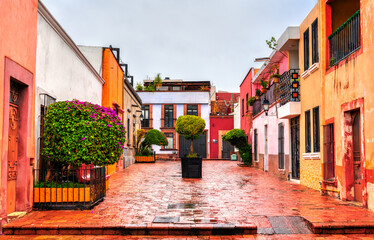 Traditional colorful houses in Santiago de Queretaro, Mexico in rainy weather