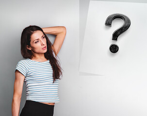 Beautiful young business young casual woman thinking and looking up on question sign on blue studio background on empty copy space. Closeup - 791248942