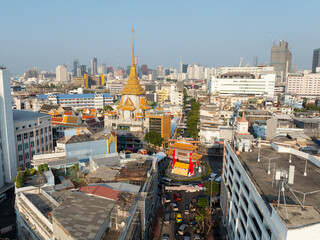 An aerial view of the Chinatown Gate and Traimit Withayaram temple, The most famous tourist attraction in Bangkok, Thailand.