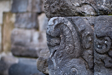 carved into the stone of a temple