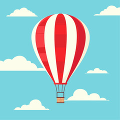 colorful red and white hot air balloon ascends into a clear blue sky, casting a round shadow on the grassy field below