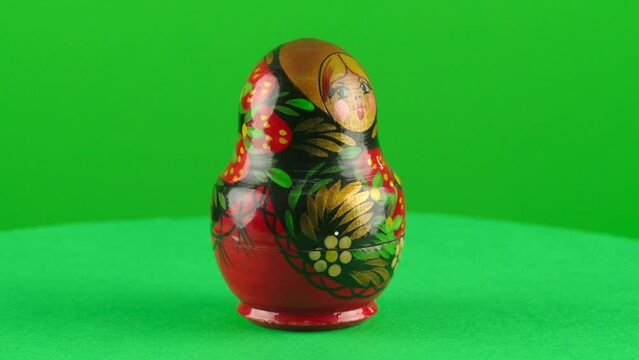 Mertyoshka matrioska doll in a turntable with green screen for background removal  