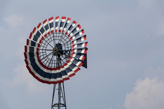 Multi-blade wind turbine made of wood Paint the national flag pattern.