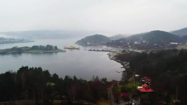 Svanesund public ferry route between Sweden and Orust, Aerial, Establishing Shot