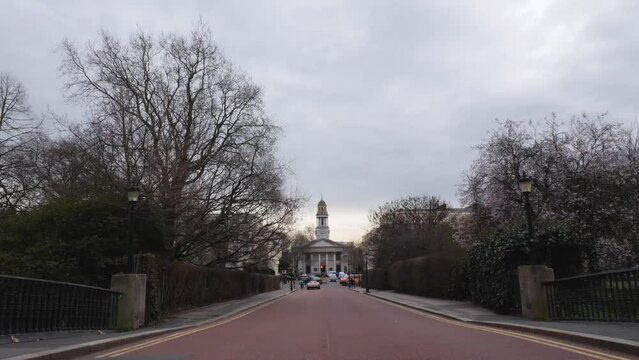 Still shot of church at the end of the road. Cars passing london.