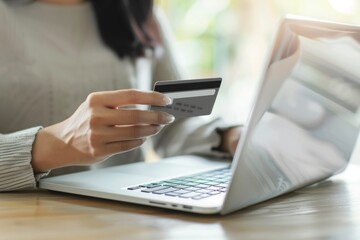 A woman typing her credit card information