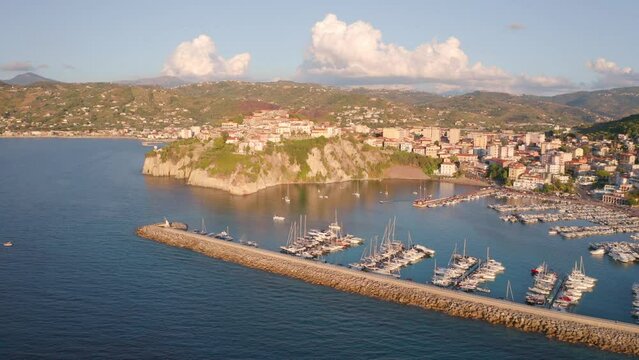 4k drone flight moving to the side footage (Ultra High Definition) of Agropoli port. Wonderful summer seascape of Mediterranean sea. Traveling concept background.