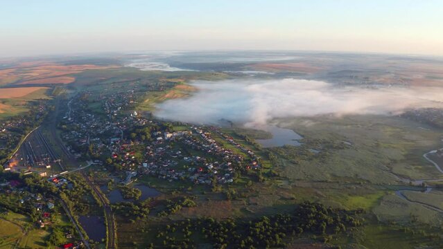 4k drone forward video (Ultra High Definition) of zigzag shape Seret river. Splendid morning scene of foggy Ternopil countryside, Ukraine, Europe. Traveling concept background.