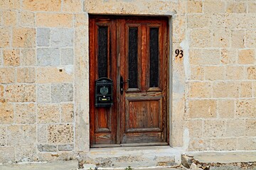 Old wooden doors with mailbox of an antique house
