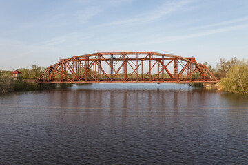 Cast iron railway bridge over the Chagan River in the city of Uralsk. Rivet Bridge