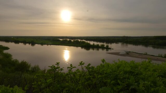 Sunset reflected at Polish Natural reservoir lake in Wilkow bay Water landscape around greenery, delta river,