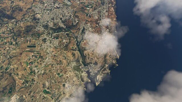Upper aerial view of Cliff Spot in Munxar overflying the clouds. Malta