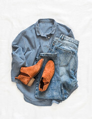 Women's casual comfortable clothes - blue cotton plaid shirt, blue jeans, chelsea boots on a light background, top view - 791314707
