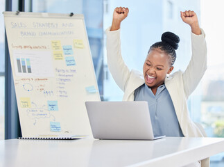 Woman, laptop and cheers with fist in office, smile and sales performance for profit, win or goals....