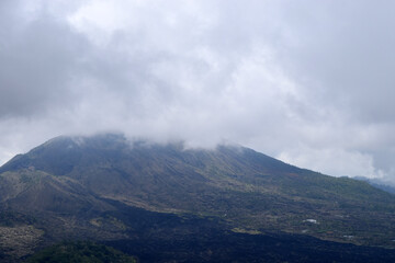Fototapeta premium Misty hills with black clouds