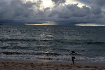 foggy beach with black clouds