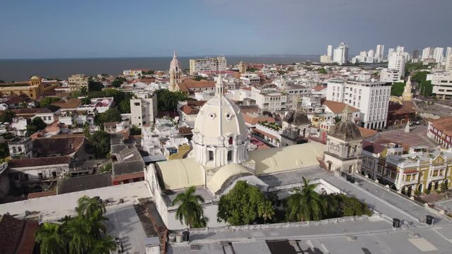 Church of San Pedro Claver in Cartagena Colombia on sunny day, aerial orbit