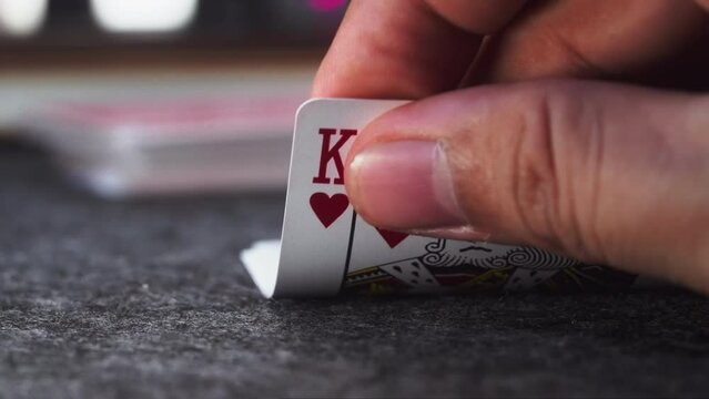 Close-Up Reveal of a Winning Blackjack Combination Held in Hand