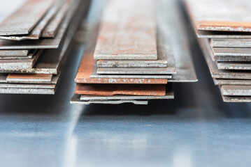 Stack of rusty steel flat bar, metallurgy industry