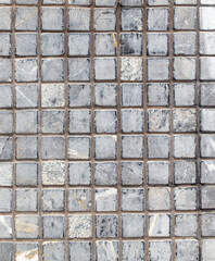 Small square tile on the wall. Abstract background