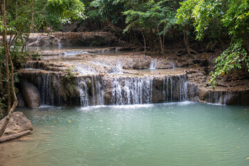 Fototapeta na wymiar Waterfall along a tropical river in Thailand