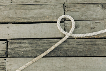 Rope on a wooden background - 791327953