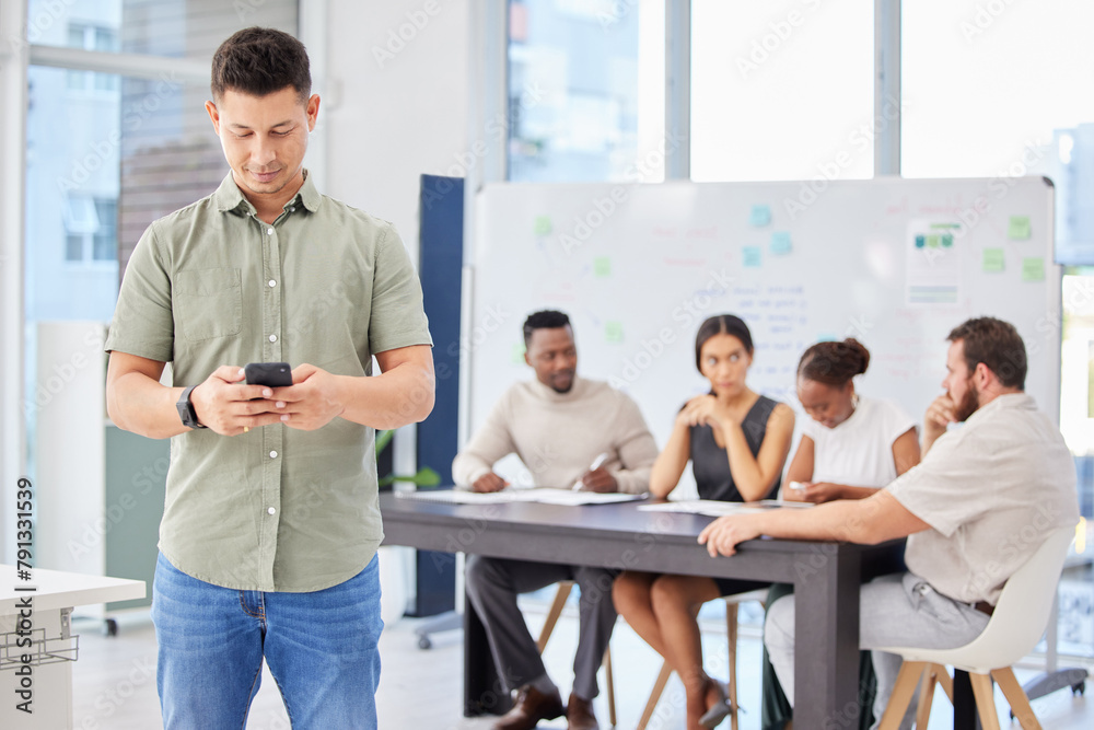 Aufkleber man, phone and texting in boardroom with colleagues, workshop and networking for deal at startup. bu