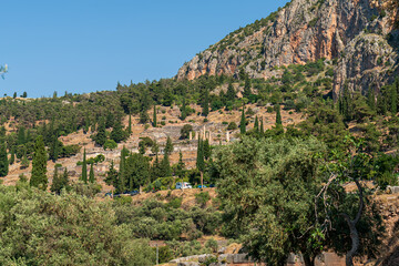 Delphi, Greece. The Ancient Theater of Delphi and Temple of Apollo. Ruins of an ancient city. Summer day