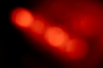 Blurred Red lights abstract background. Defocused glittering lights. Colorful wallpaper for design