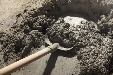 Shovel and concrete on a construction site. - 791336791