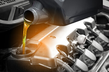 Refueling and pouring oil quality into the engine motor car Transmission and Maintenance Gear...