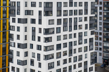 New apartment buildings with windows and balconies. Modern european complex