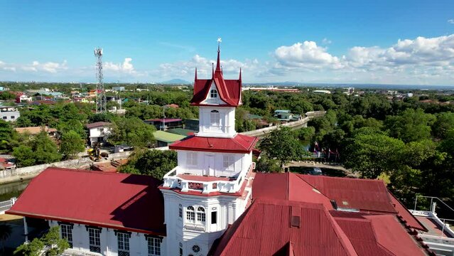 Kawit, Cavite, Philippines - Aerial flyby of Emilio Aguinaldo Shrine and the Philippine Flag.