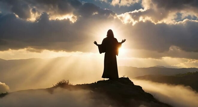 Silhouette of Jesus Praying on Hill Crest: Sun Rays and Mystic Clouds Create a Reverent Backdrop