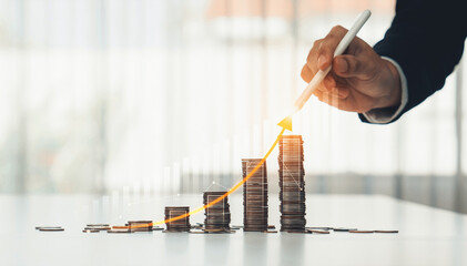 Coin stack with digital graphic indicator symbolizing business investment and economic growth....