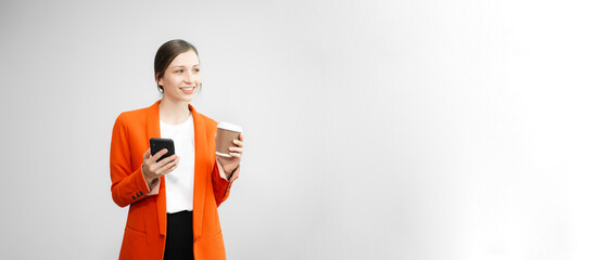 Portrait photo of young beautiful woman feeling happy and holding smart phone, tablet and laptop with black empty screen on white background can use for advertising or product presenting concept.