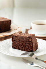 Fototapeta na wymiar Fresh homemade chocolate sponge cake on wooden board