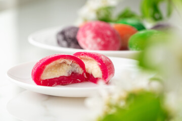 Multi-colored Japanese cakes Mochi in a white plate