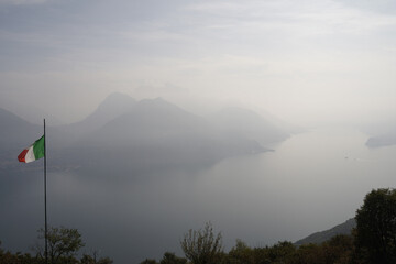 View of a glimpse of Lake Como from the village of Monti di Treccione. On the right, on the edge,...