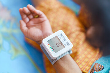 Self-measurement of blood pressure using a device on the wrist of the elderly.