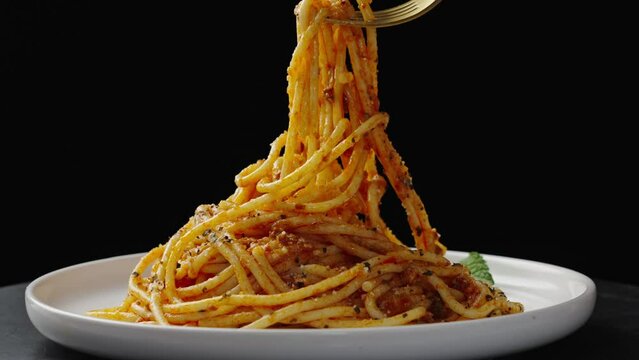 Traditional pasta spaghetti in plate on table.
