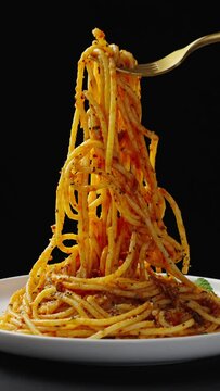 Traditional pasta spaghetti in plate on table.