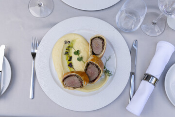 Top view oa a beef Wellington served on plate with mashed potato - 791378510