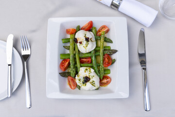 Caprese salad with asparagus served on a plate, top view - 791378700