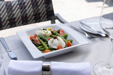 Caprese salad with asparagus served in the restaurant - 791378761