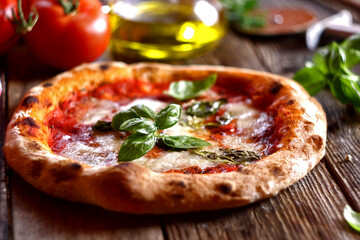 Neapolitan pizza with mozzarella, tomatoes and basil leaves.
Homemade pizza margherita. Selective focus