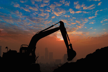 Silhouette of Crawler Excavator in the construction site on the sky sunset  background