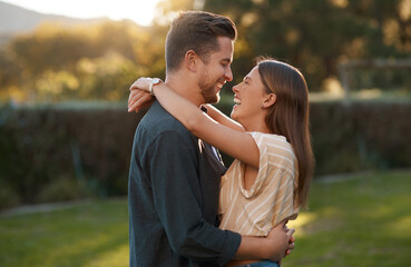 Couple, hug and laughing in garden park for relationship funny joke with bonding, embrace or humor. Man, woman and happy at sunset for honeymoon travel in Australia with loving, date or anniversary