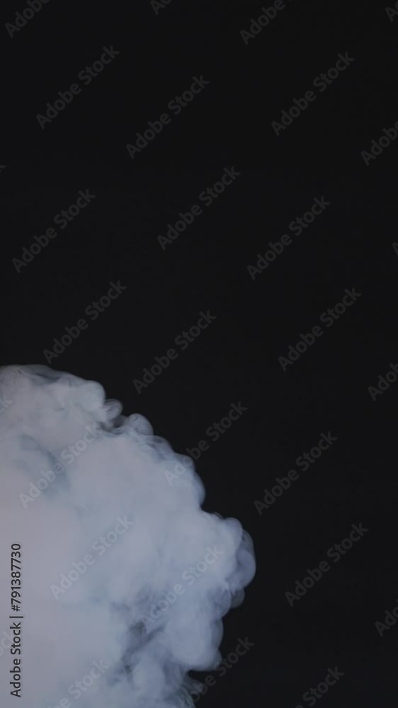 Wall mural Stream of smoke on a black background slow motion